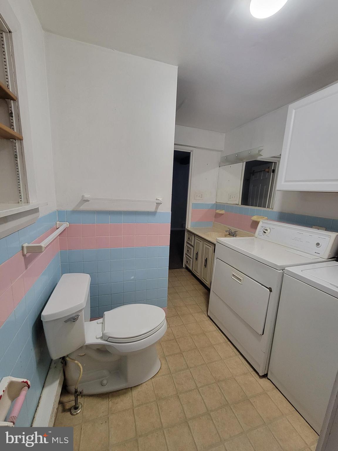 1476 Zebley Road Garnet Valley, PA 19060 - Photo 8 of 15 a bathroom with a toilet a sink and a mirror
