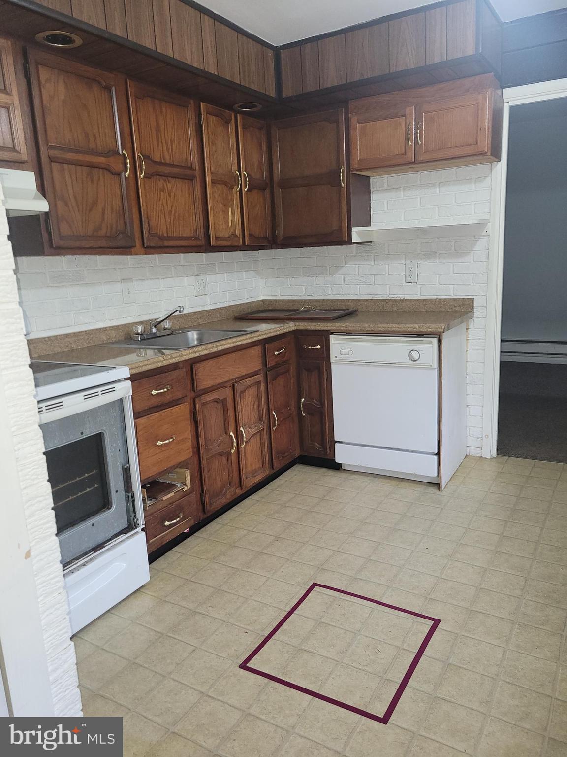 1476 Zebley Road Garnet Valley, PA 19060 - Photo 10 of 15 a kitchen with stainless steel appliances granite countertop a stove a sink and a microwave