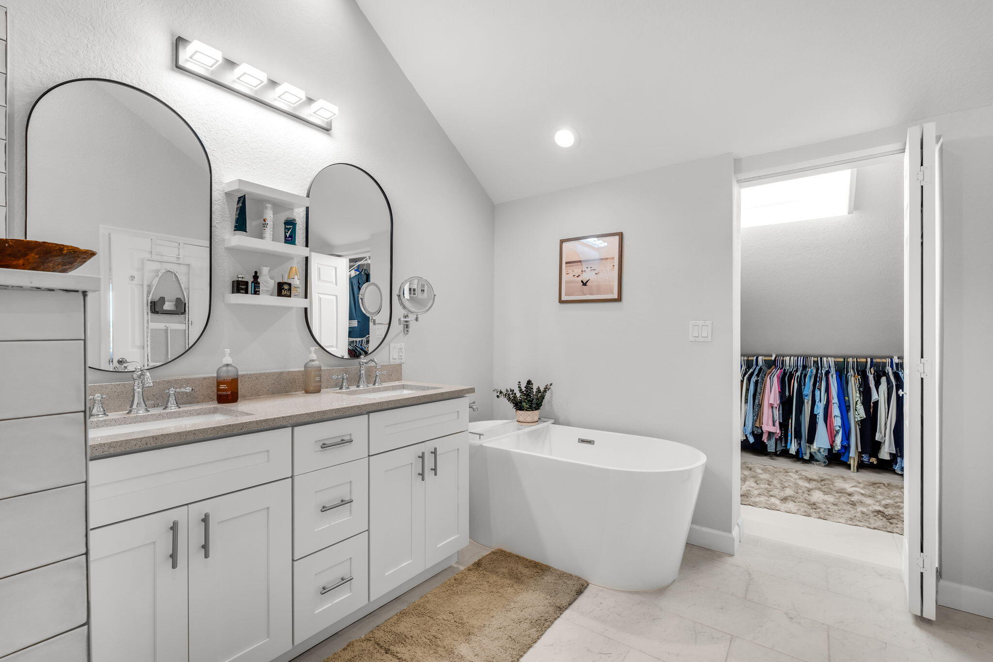 24 Mutiny Place Key Largo, FL 33037 - Photo 30 of 69 a spacious bathroom with a double vanity sink a mirror and a bathtub