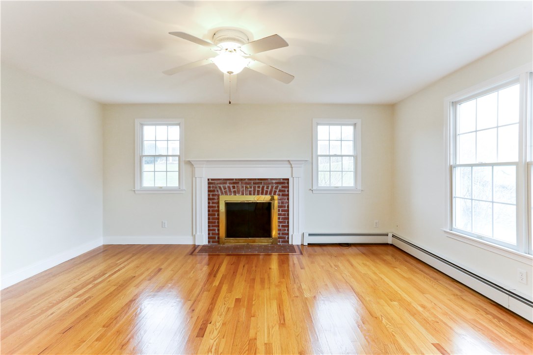 63 Prospect Farm Road Portsmouth, RI 02871 - Photo 14 of 34 family room with wood burning fireplace