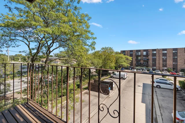 a view of balcony with wooden floor