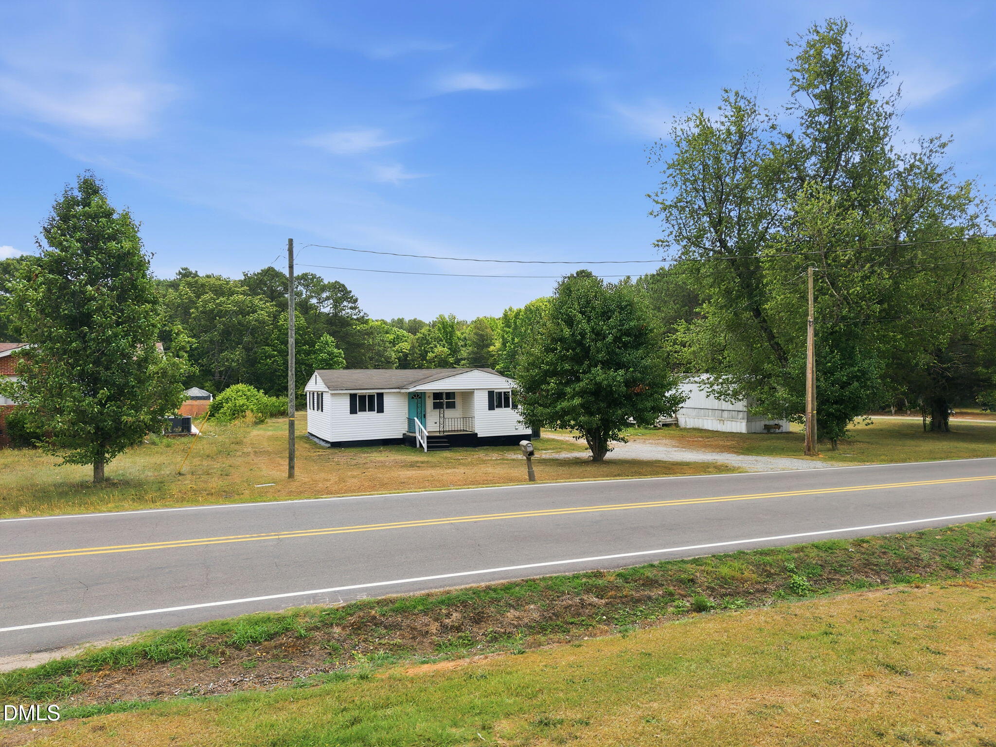 1758 Barber Mill Road Clayton, NC 27520 - Photo 21 of 41 a view of a house with a big yard and large trees