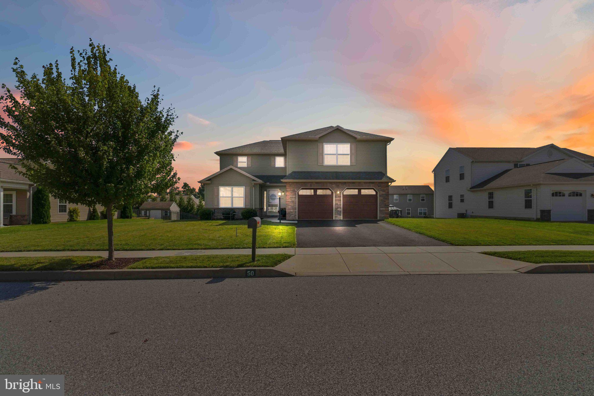 Charming home under a vibrant sunset.