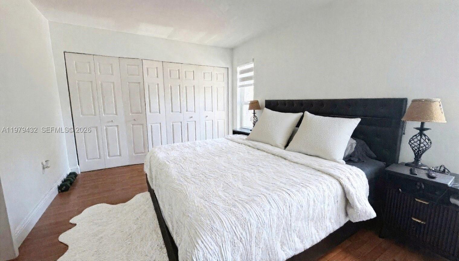 483 North Pine Island Road, Unit C205 Plantation, FL 33324 - Photo 13 of 22 a bedroom with a bed and a window