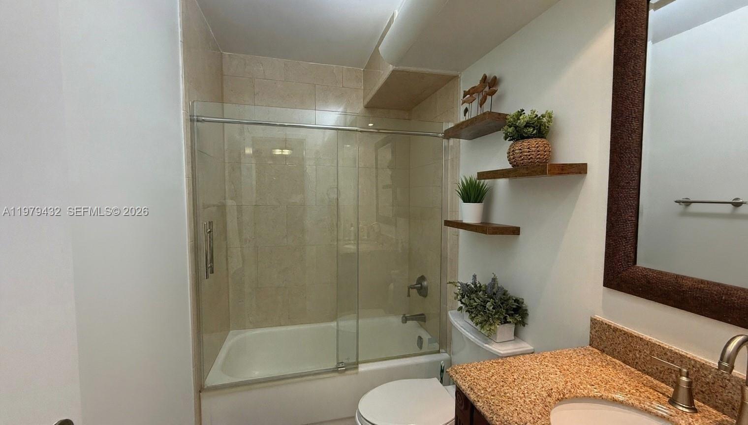 483 North Pine Island Road, Unit C205 Plantation, FL 33324 - Photo 14 of 22 a bathroom with a shower and a toilet