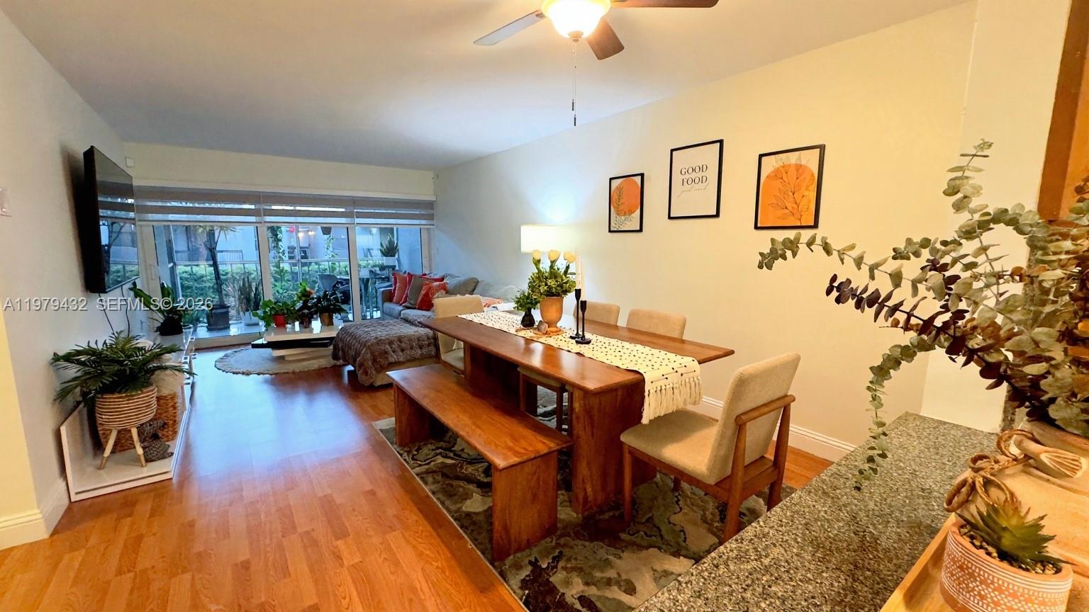 483 North Pine Island Road, Unit C205 Plantation, FL 33324 - Photo 4 of 22 a living room with furniture and a large window