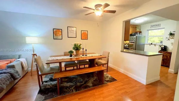 a living room with a bed furniture and a window