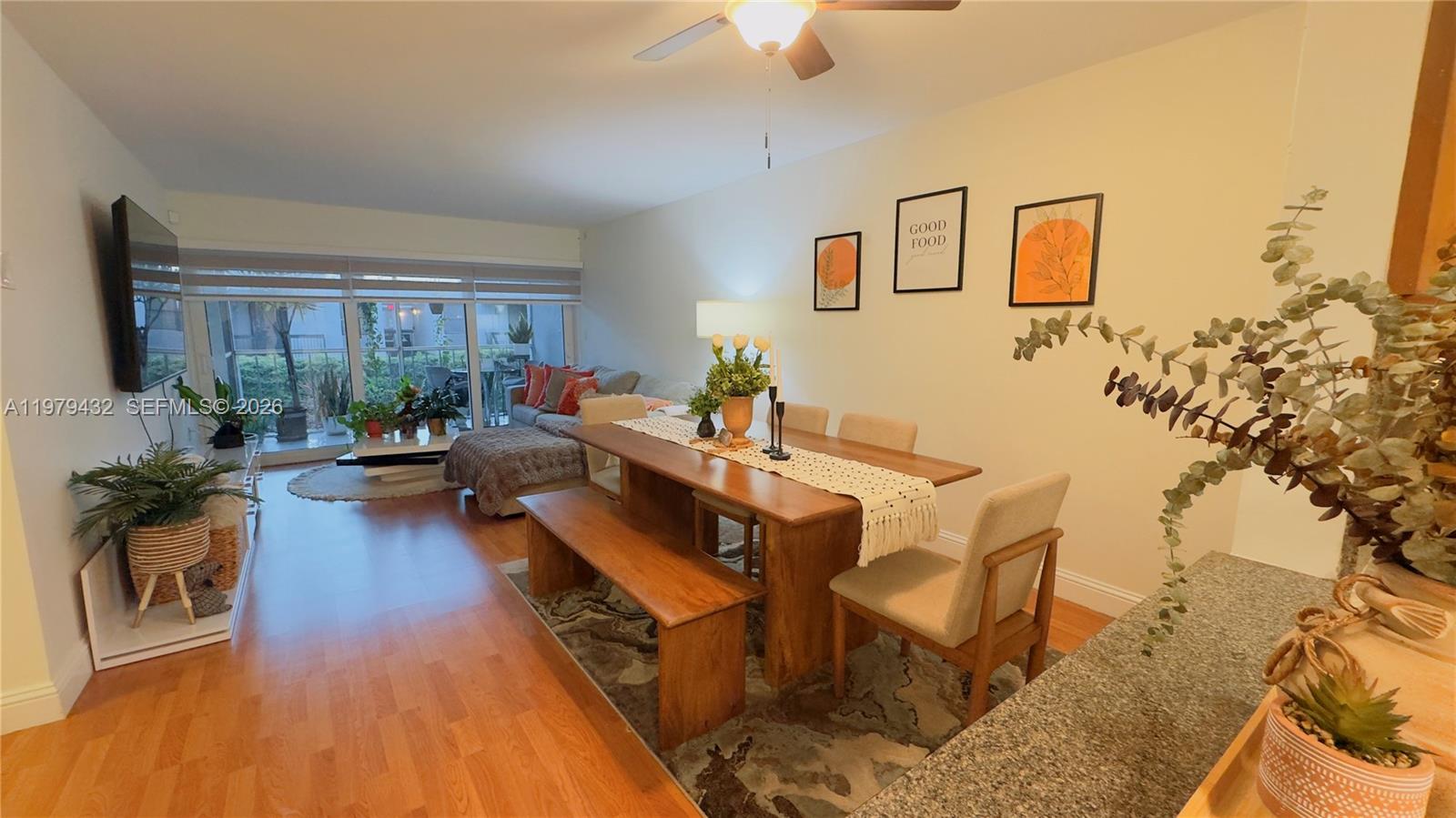 483 North Pine Island Road, Unit C205 Plantation, FL 33324 - Photo 9 of 22 a living room with furniture and a large window
