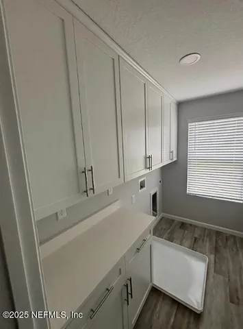 a view of an empty room and a window