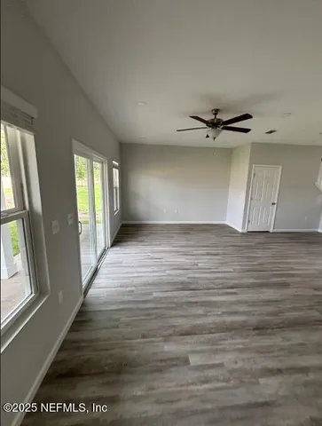 a living room with kitchen island granite countertop furniture and a fireplace