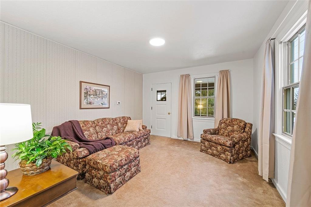 47 Ewing Road McKees Rocks, PA 15136 - Photo 4 of 28 Easy access to covered side porch from the cozy living room