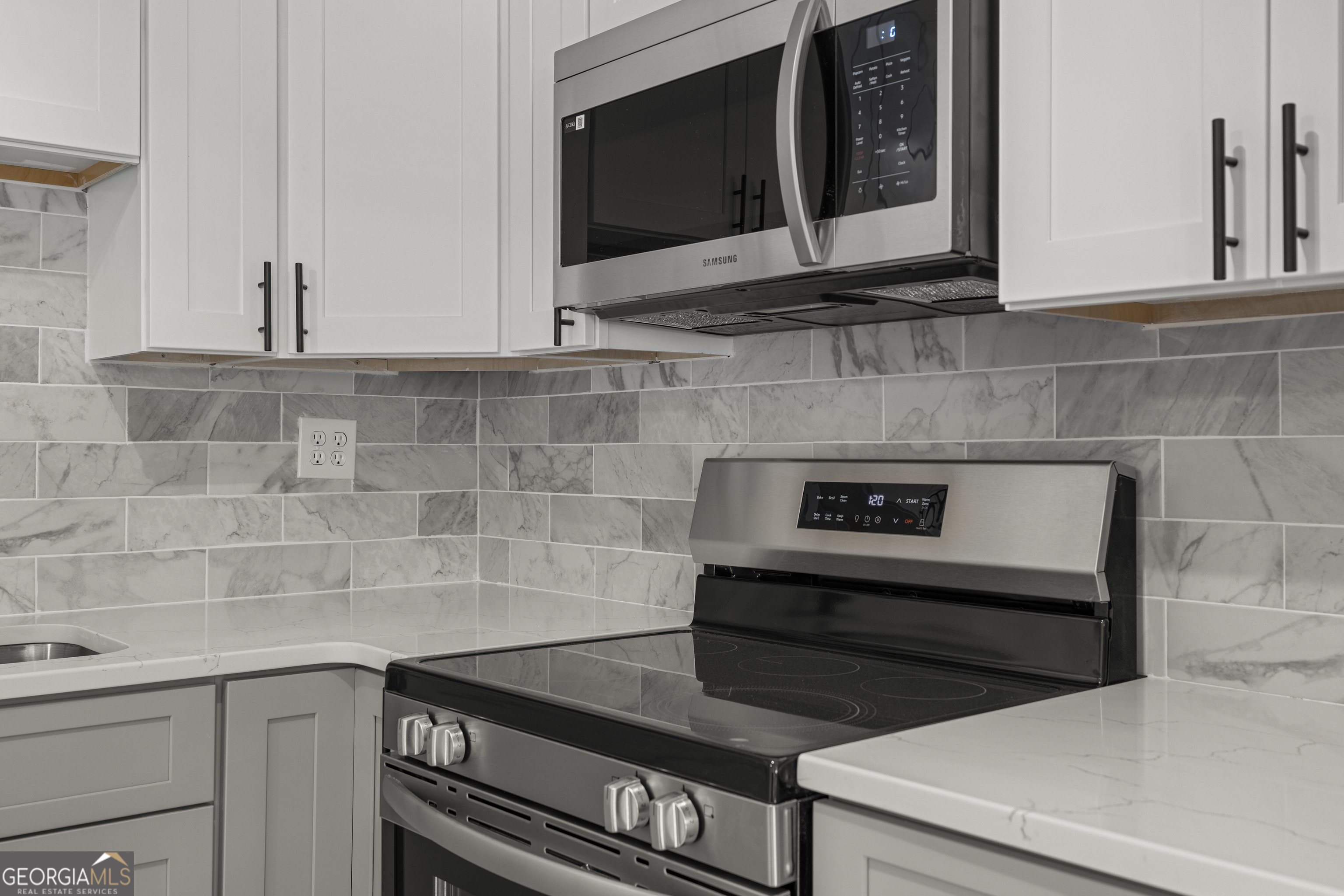2312 Burnside Drive Columbus, GA 31907 - Photo 12 of 29 a kitchen with a stove and a microwave