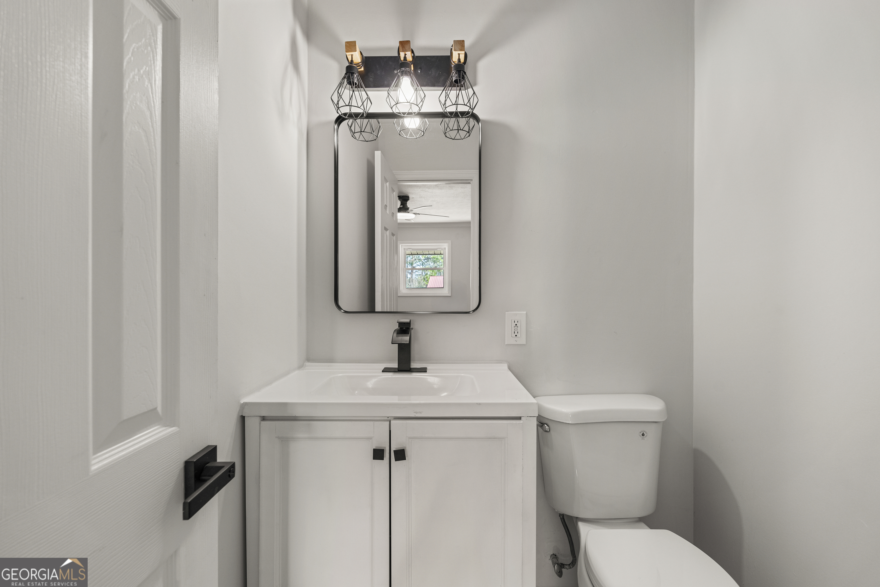 2312 Burnside Drive Columbus, GA 31907 - Photo 14 of 29 a bathroom with a toilet sink and mirror