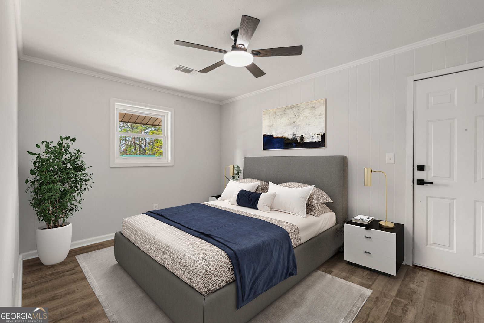 2312 Burnside Drive Columbus, GA 31907 - Photo 18 of 29 a bedroom with a large bed and a potted plant