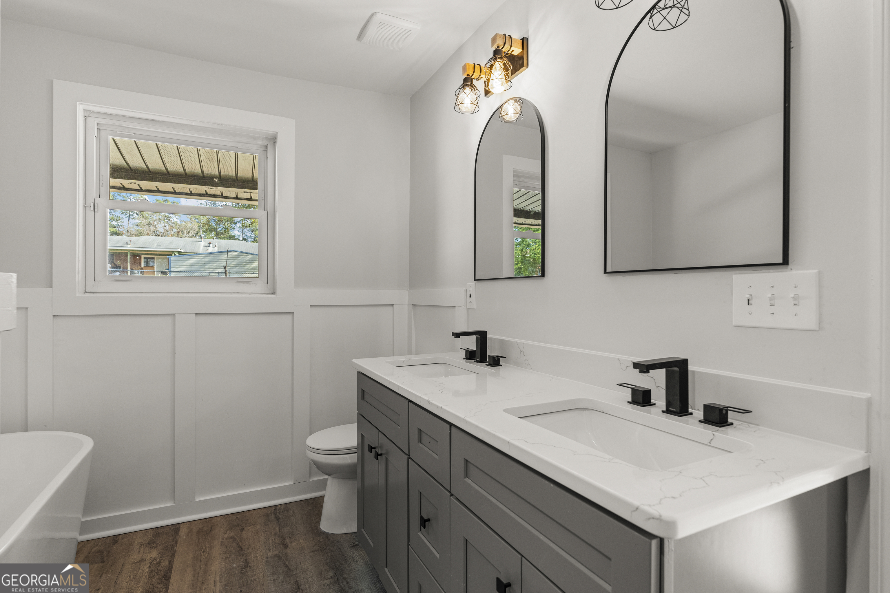 2312 Burnside Drive Columbus, GA 31907 - Photo 23 of 29 a bathroom with a sink a toilet and a mirror