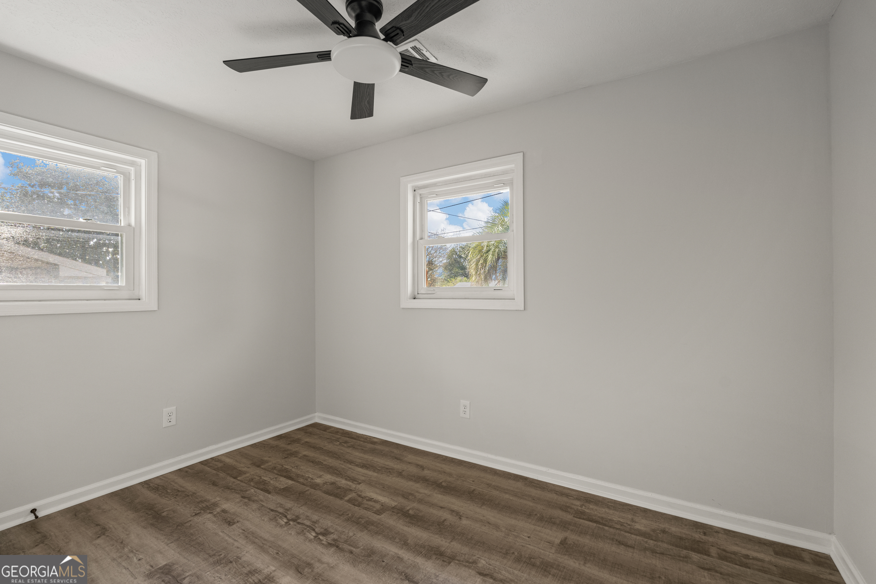 2312 Burnside Drive Columbus, GA 31907 - Photo 24 of 29 a view of an empty room with wooden floor and a window