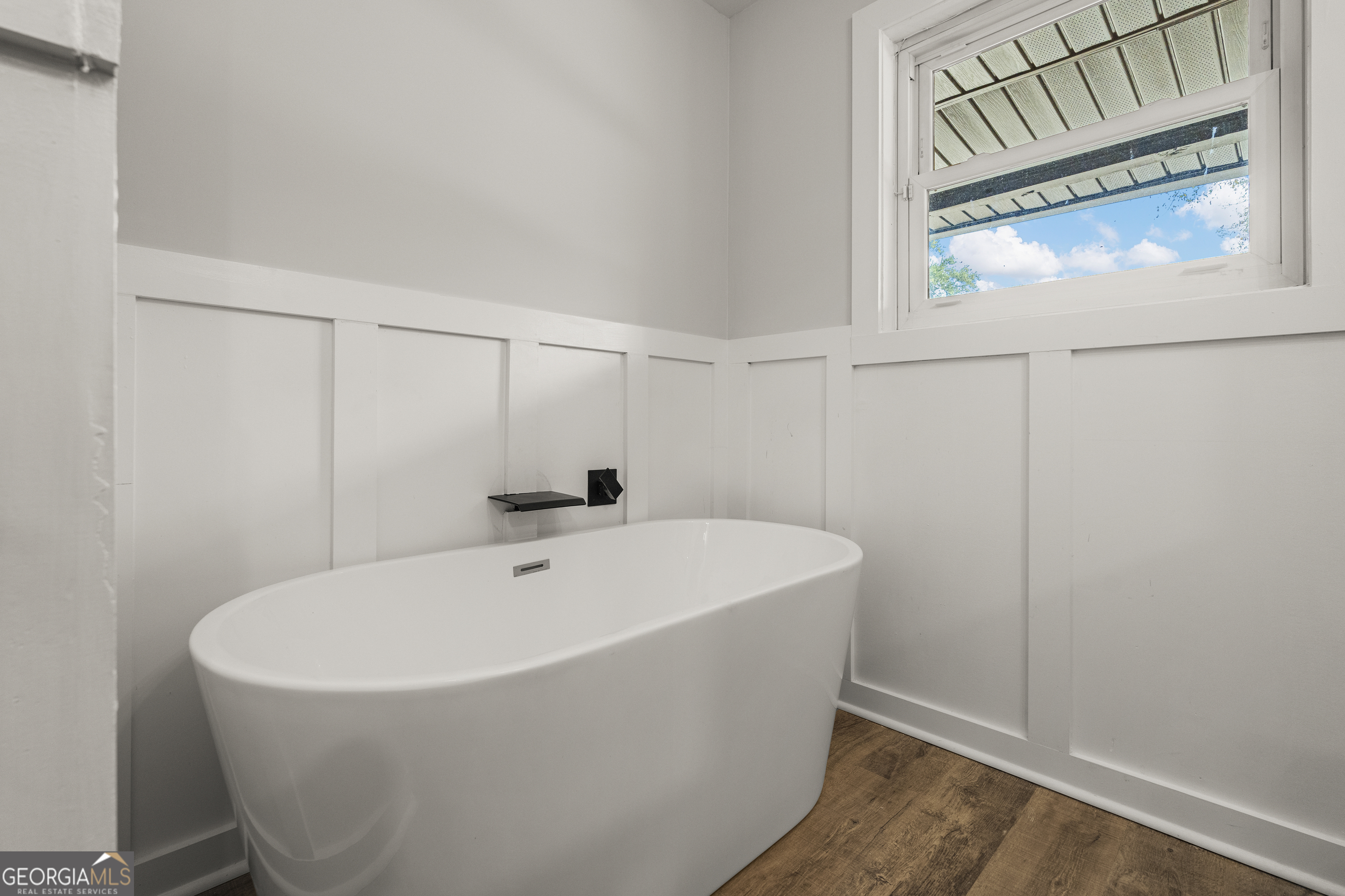 2312 Burnside Drive Columbus, GA 31907 - Photo 25 of 29 a white bath tub sitting in a bathroom