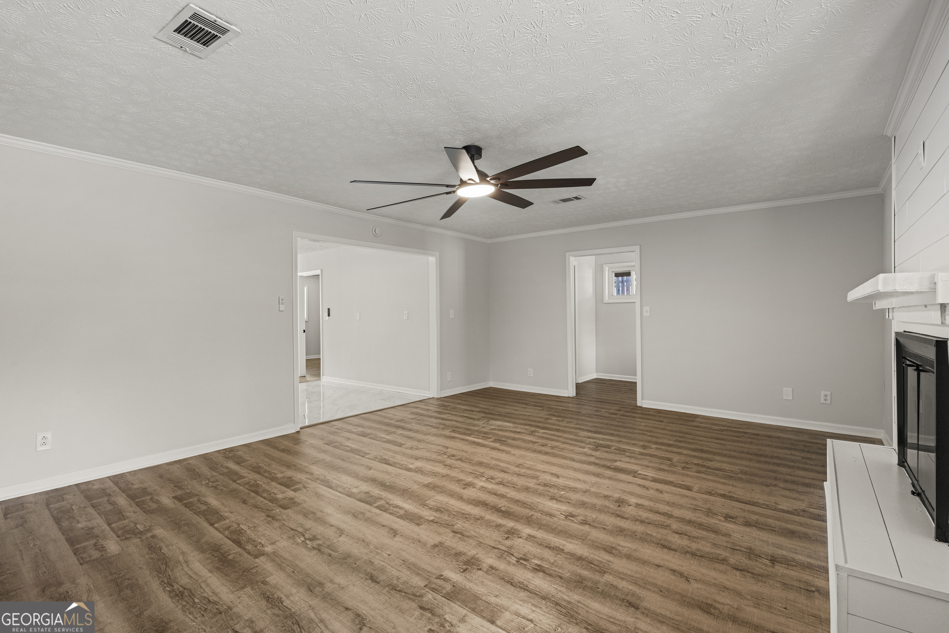 2312 Burnside Drive Columbus, GA 31907 - Photo 6 of 29 a view of an empty room with a ceiling fan
