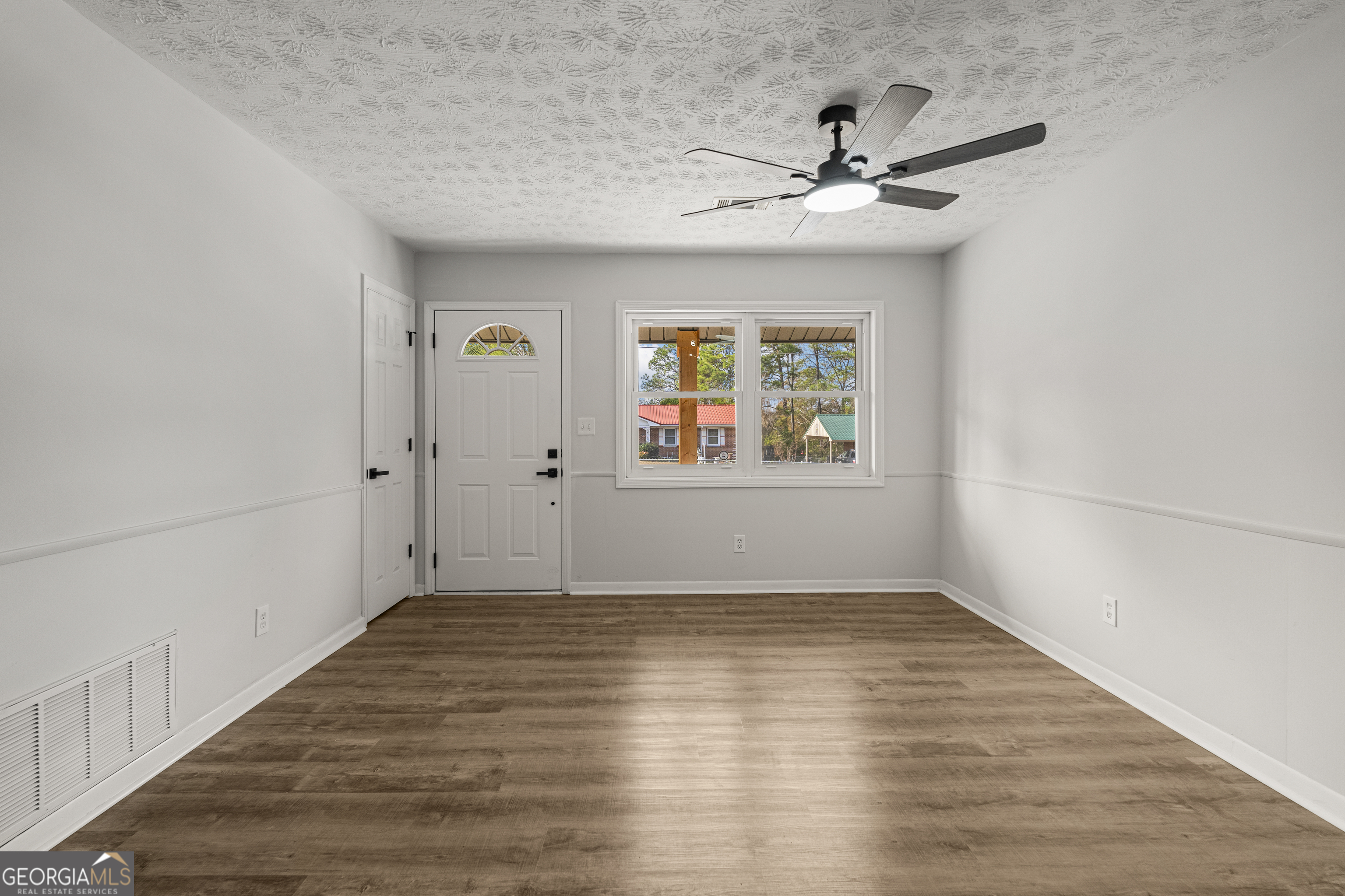 2312 Burnside Drive Columbus, GA 31907 - Photo 7 of 29 a view of a hallway with wooden floor and a window