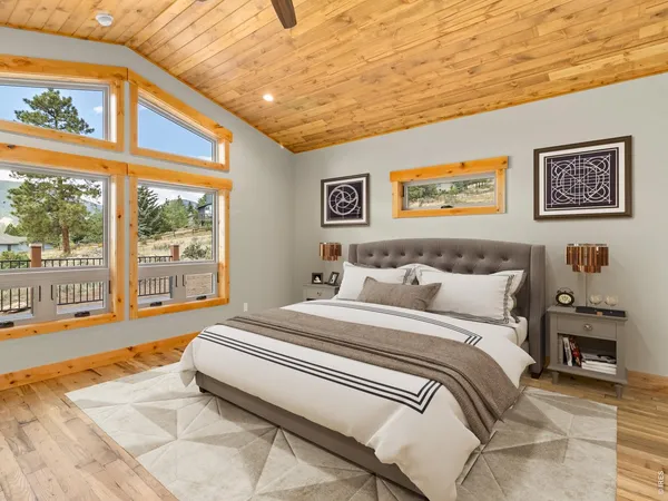 a spacious bedroom with a bed and a large window