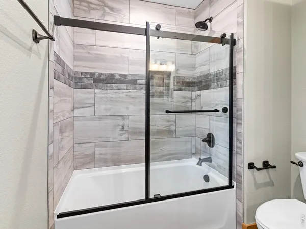 a bathroom with a shower and bathtub