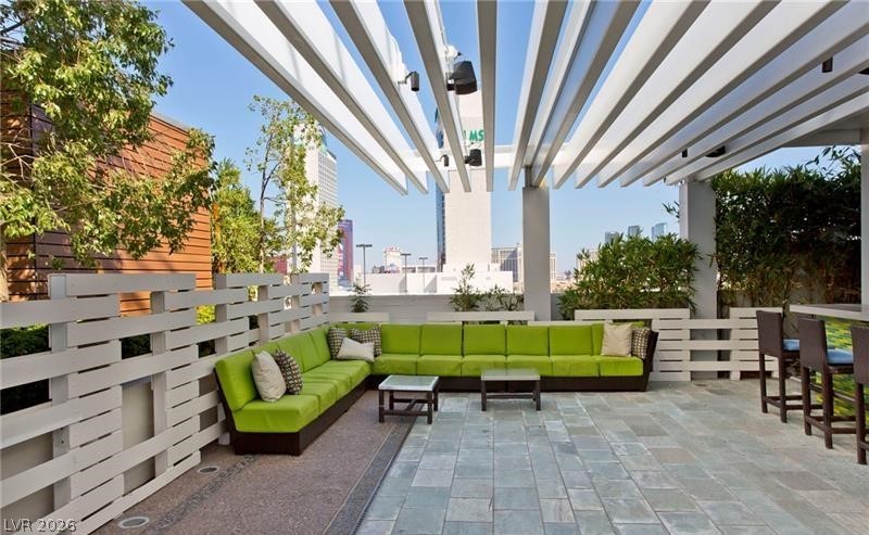 4381 West Flamingo Road, Unit 15310 Las Vegas, NV 89103 - Photo 37 of 52 View of patio featuring outdoor lounge area and a pergola