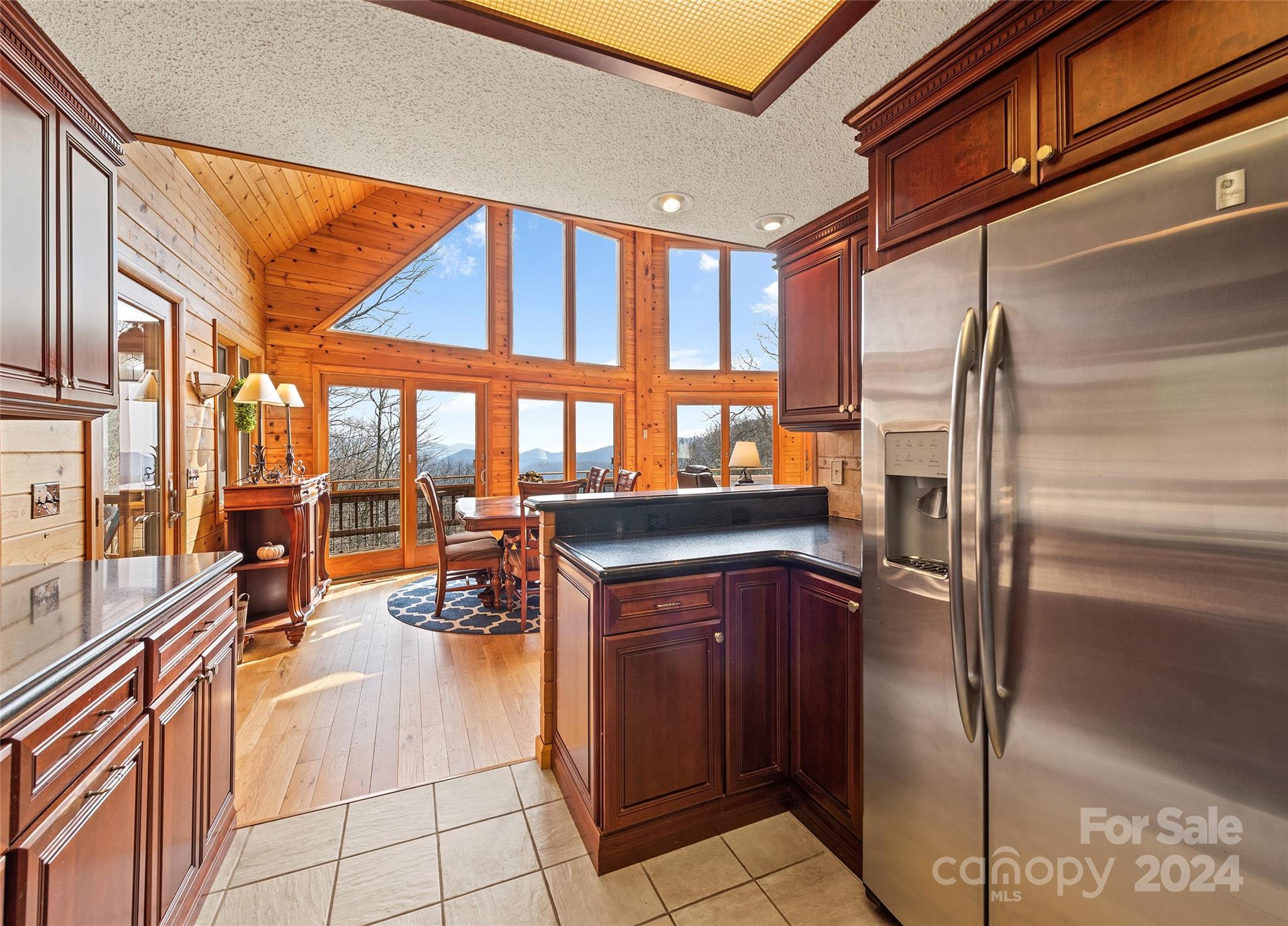 2521 Pless Underwood Road Maggie Valley, NC 28751 - Photo 15 of 46 a kitchen with stainless steel appliances granite countertop a refrigerator a oven and a sink