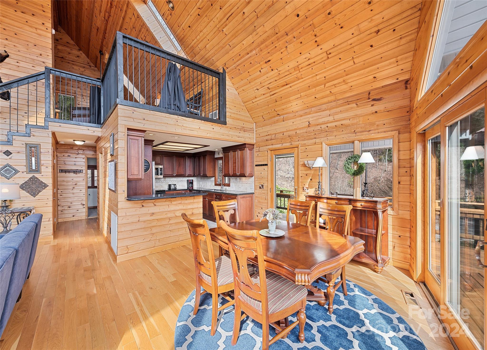 2521 Pless Underwood Road Maggie Valley, NC 28751 - Photo 16 of 46 a dining room with furniture and wooden floor