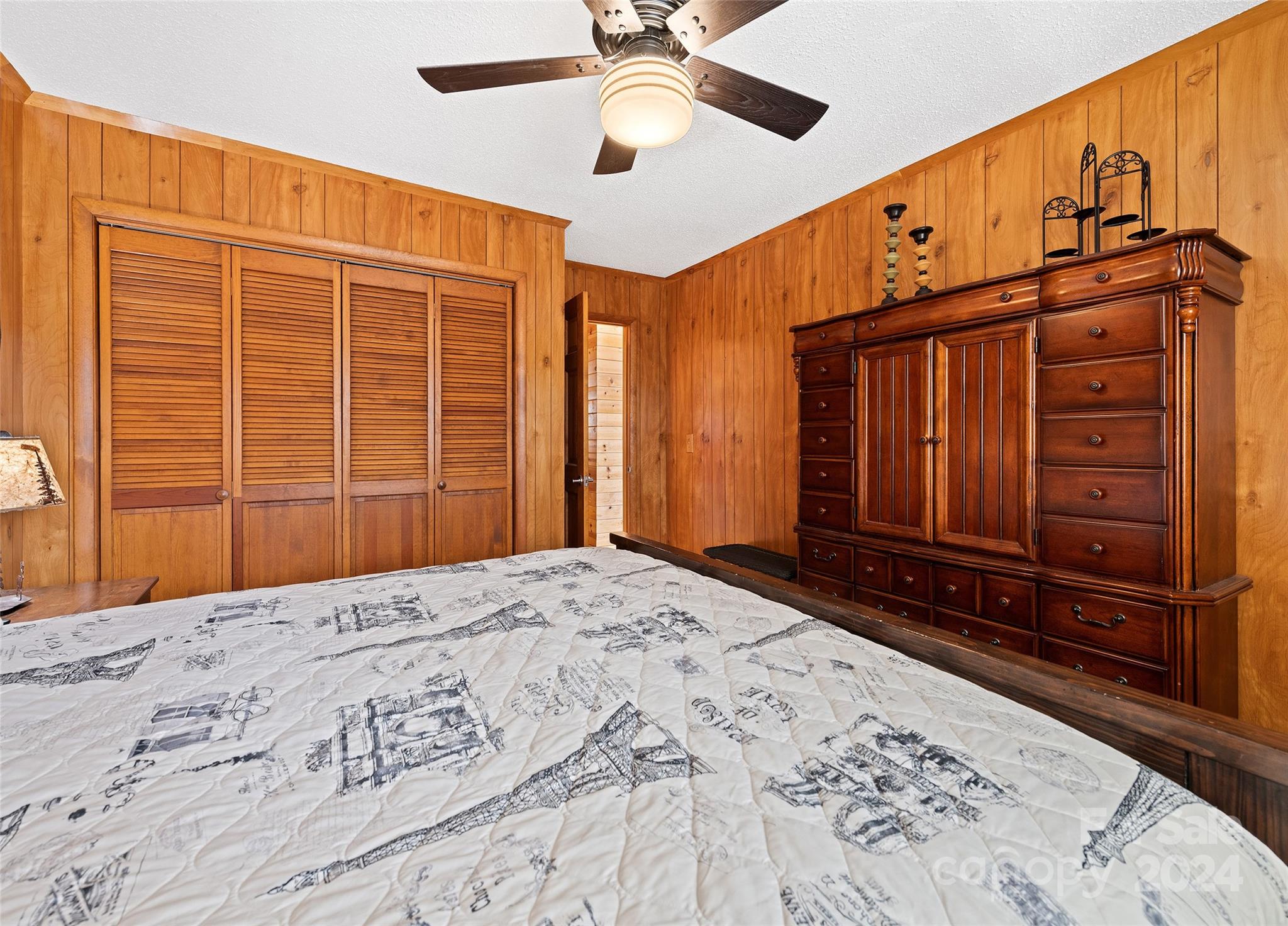 2521 Pless Underwood Road Maggie Valley, NC 28751 - Photo 18 of 46 a view of a bedroom with closet and wooden floor