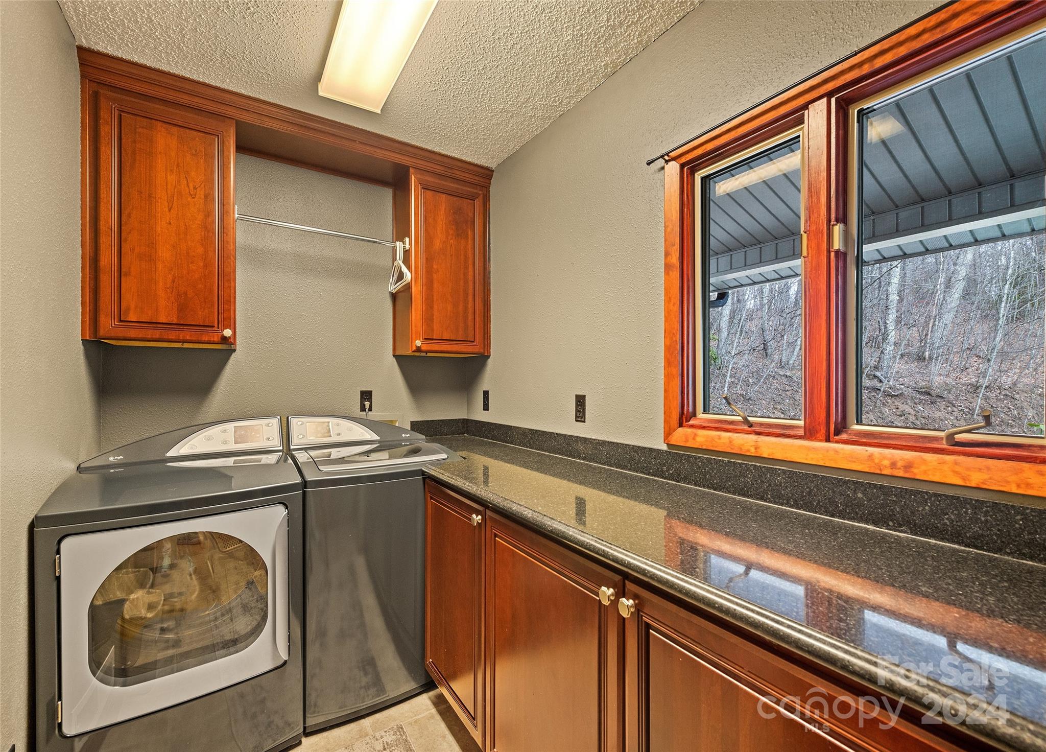 2521 Pless Underwood Road Maggie Valley, NC 28751 - Photo 20 of 46 a utility room with sink dryer and washer