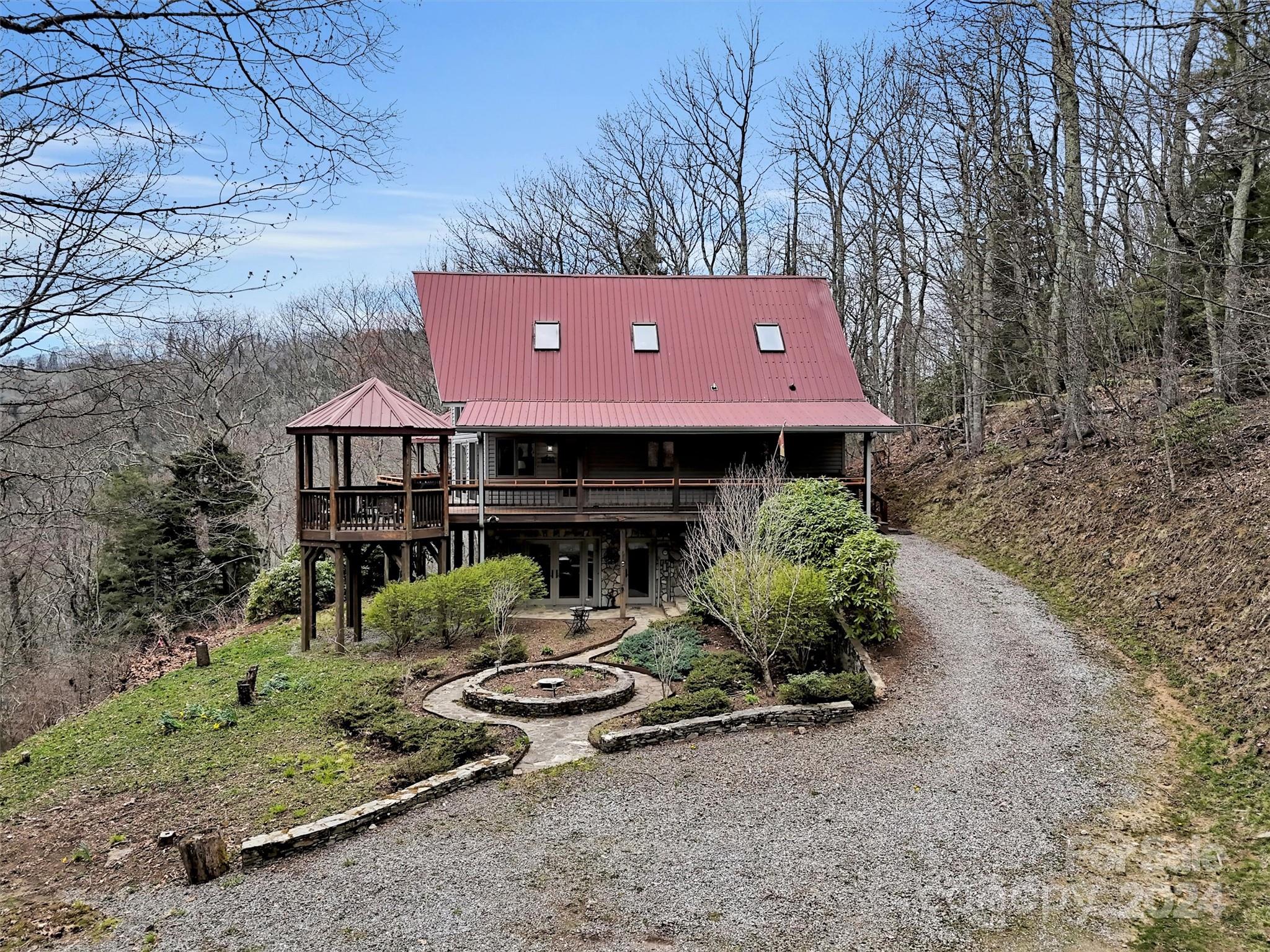 2521 Pless Underwood Road Maggie Valley, NC 28751 - Photo 2 of 46 a front view of a house with garden