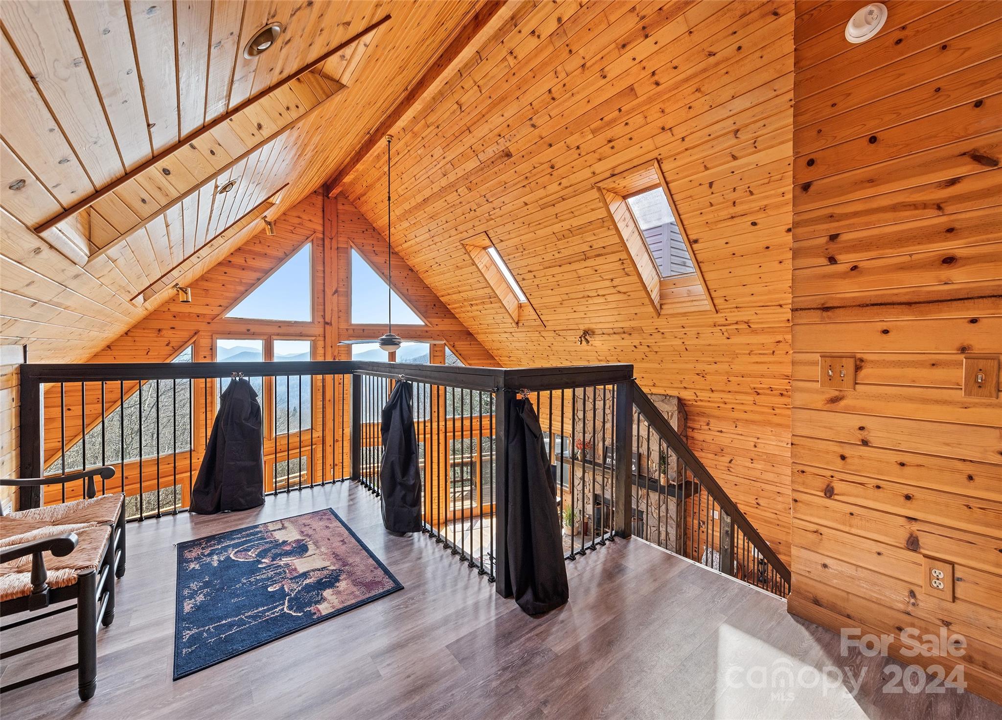 2521 Pless Underwood Road Maggie Valley, NC 28751 - Photo 22 of 46 a balcony with wooden floor and iron stairs