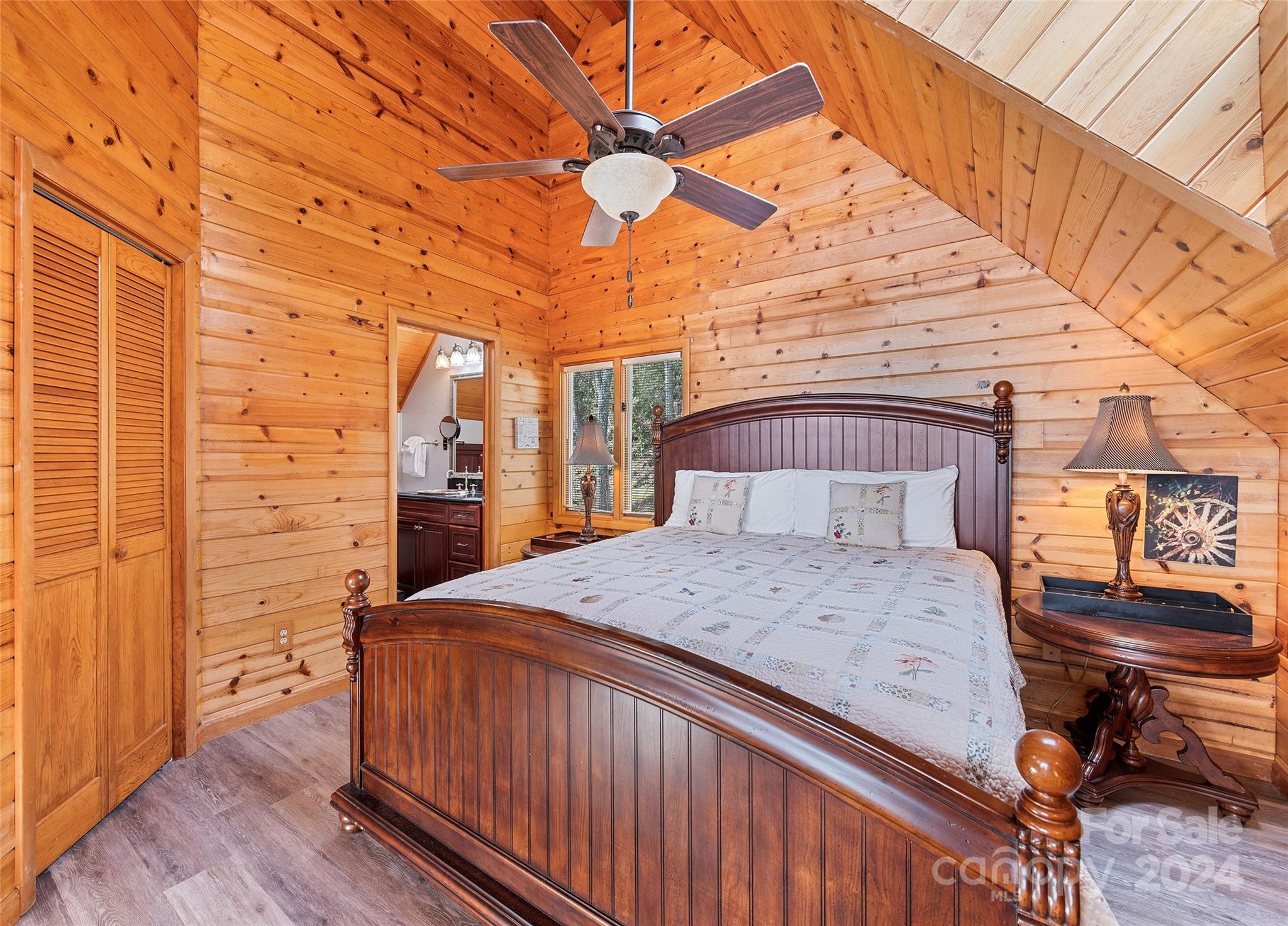 2521 Pless Underwood Road Maggie Valley, NC 28751 - Photo 24 of 46 a bedroom with a bed and wooden floor