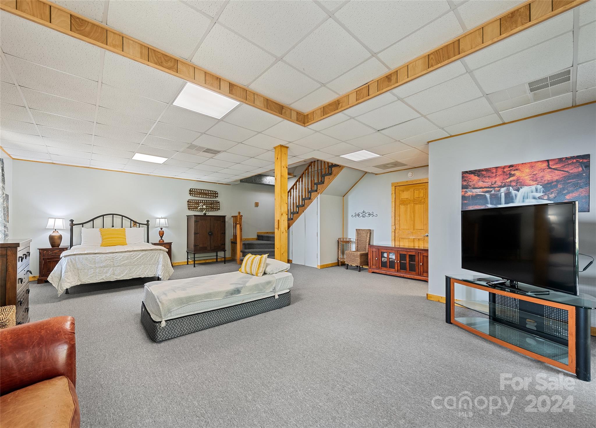 2521 Pless Underwood Road Maggie Valley, NC 28751 - Photo 26 of 46 a living room with furniture and a flat screen tv