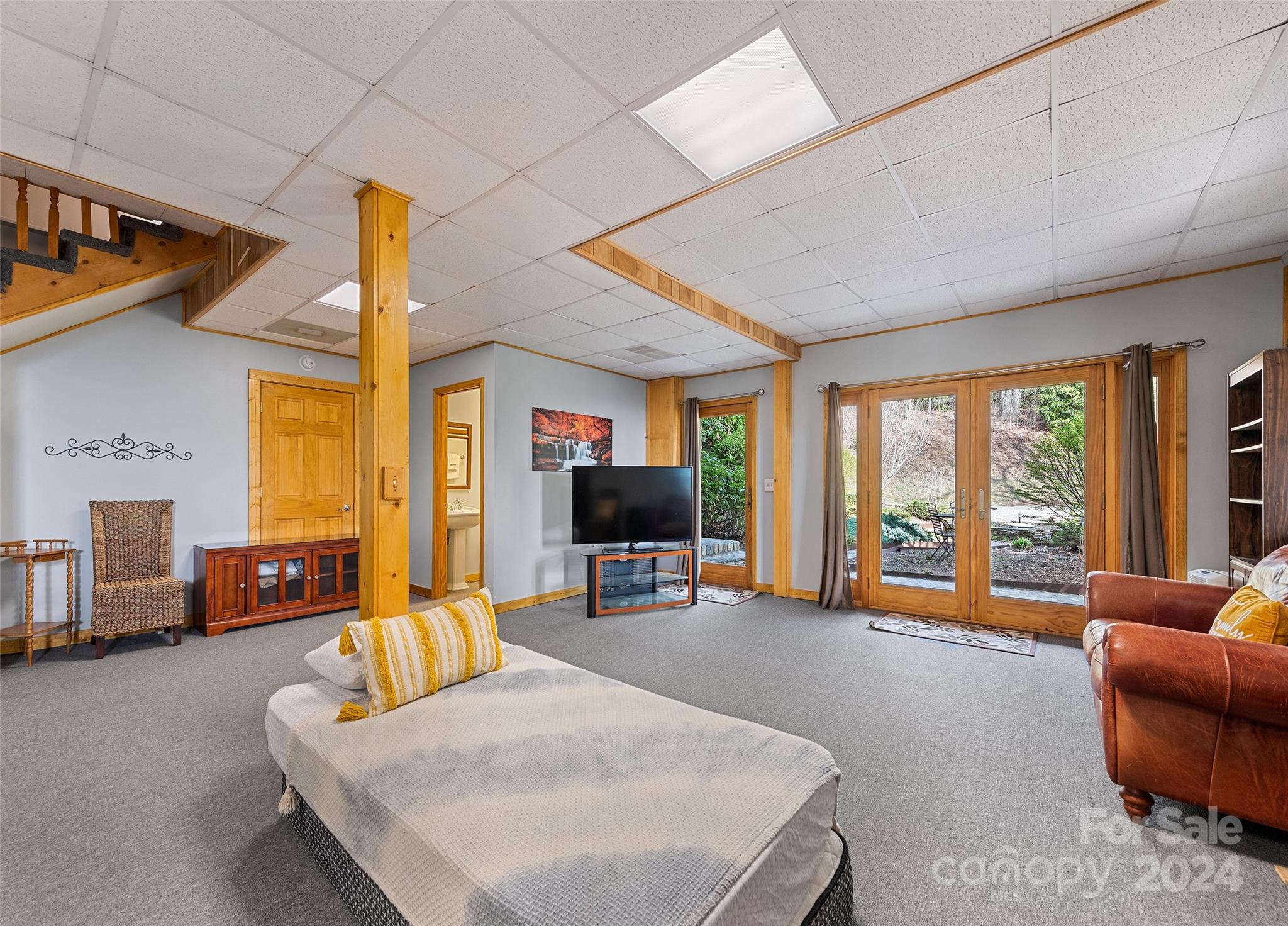 2521 Pless Underwood Road Maggie Valley, NC 28751 - Photo 27 of 46 a living room with furniture and a flat screen tv