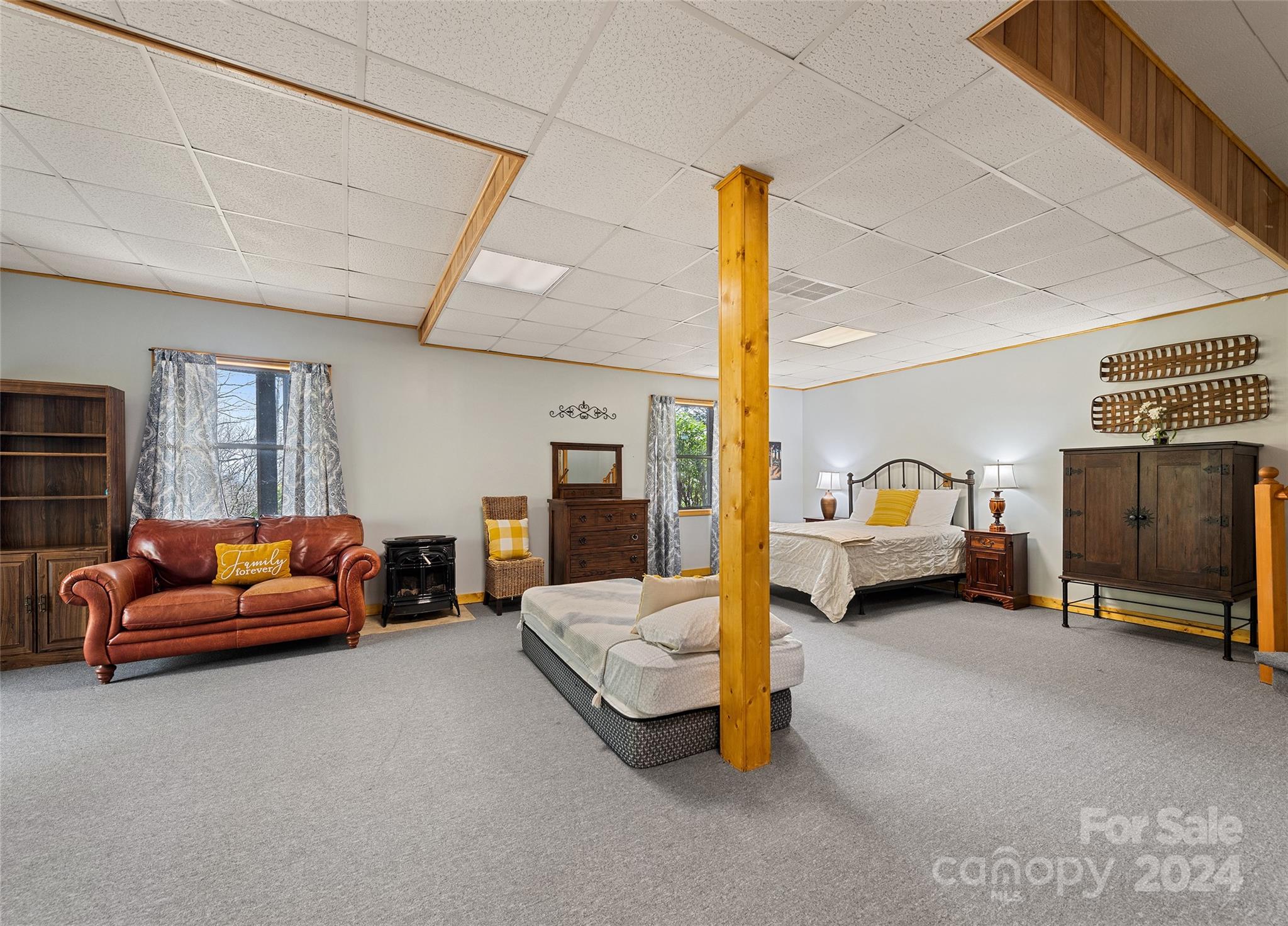 2521 Pless Underwood Road Maggie Valley, NC 28751 - Photo 28 of 46 a living room with furniture and a flat screen tv