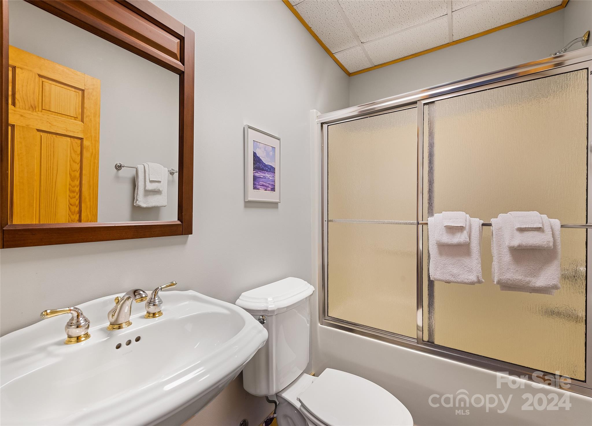 2521 Pless Underwood Road Maggie Valley, NC 28751 - Photo 30 of 46 a bathroom with a sink mirror vanity and toilet