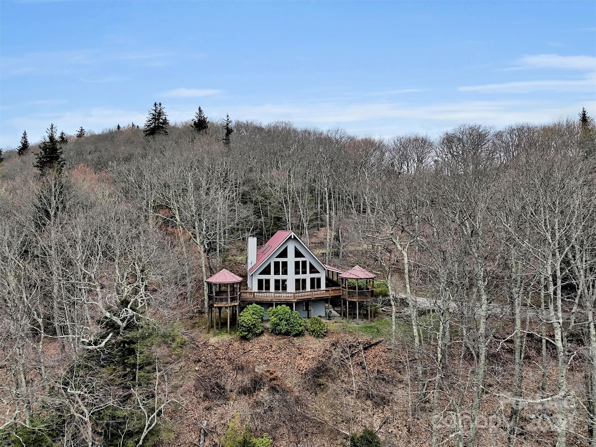2521 Pless Underwood Road Maggie Valley, NC 28751 - Photo 37 of 46 a house with trees in the background