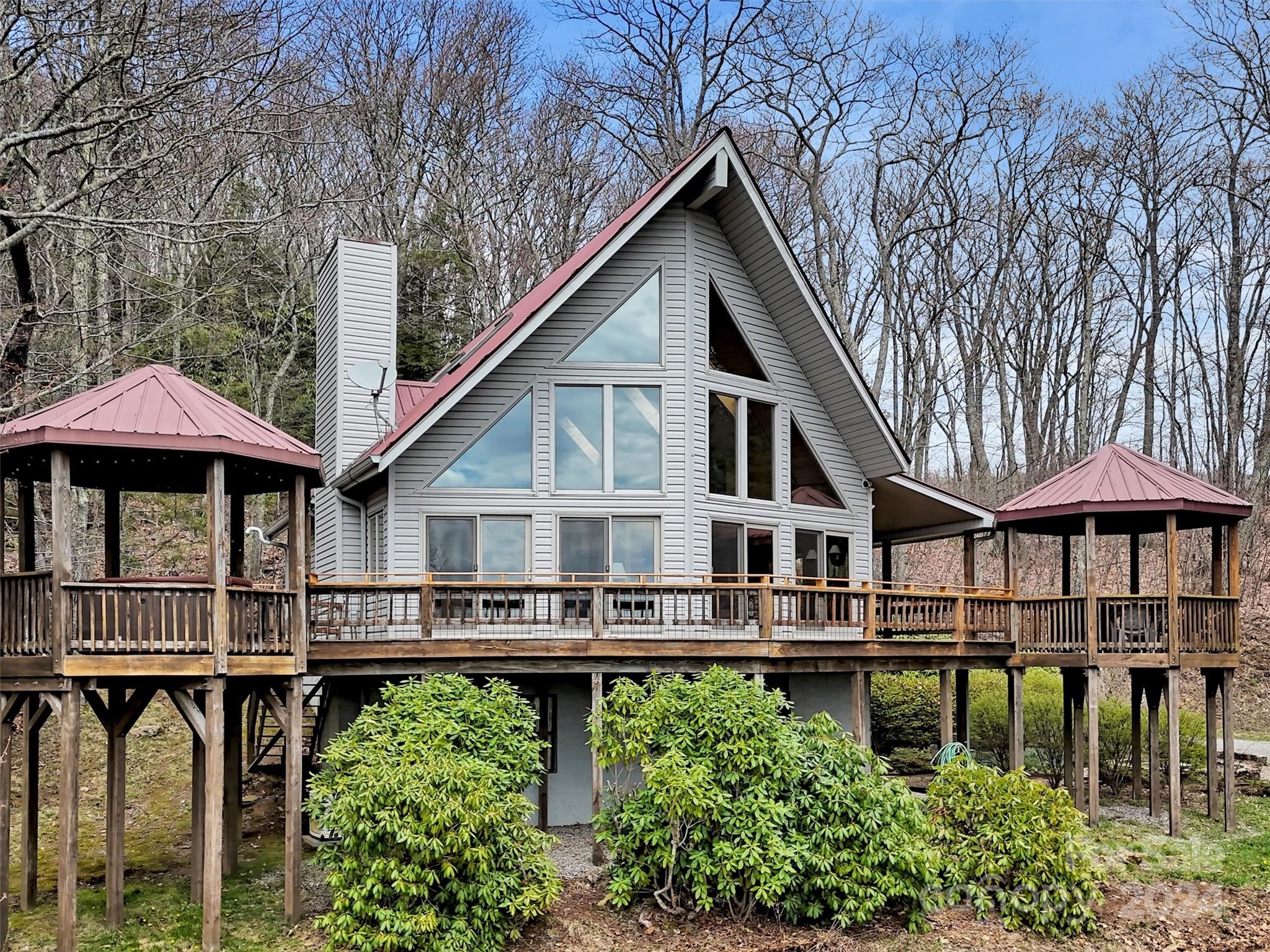 2521 Pless Underwood Road Maggie Valley, NC 28751 - Photo 39 of 46 a front view of a house with balcony and swimming pool