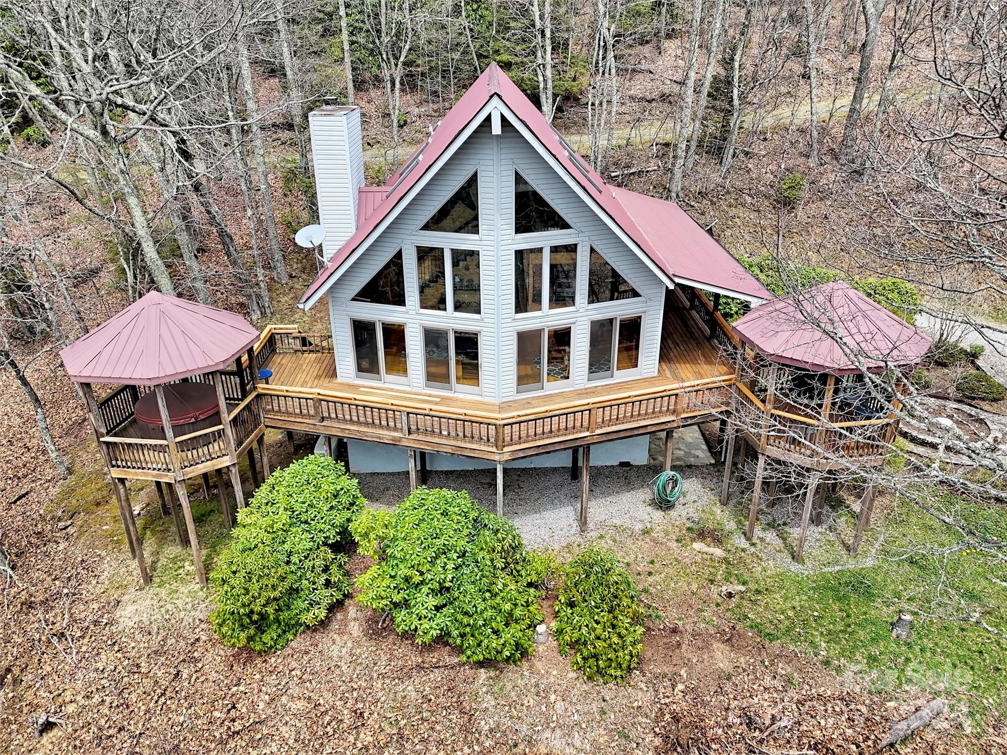 2521 Pless Underwood Road Maggie Valley, NC 28751 - Photo 40 of 46 a backyard of a house with table and chairs
