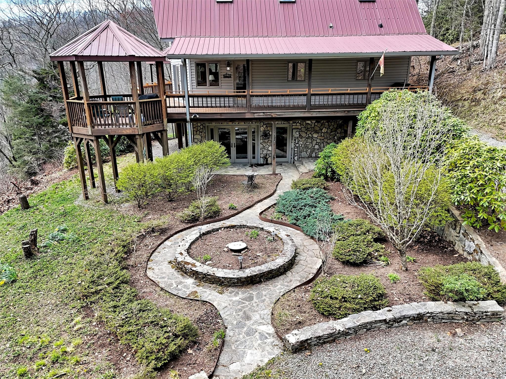 2521 Pless Underwood Road Maggie Valley, NC 28751 - Photo 43 of 46 an aerial view of a house roof deck and outdoor seating