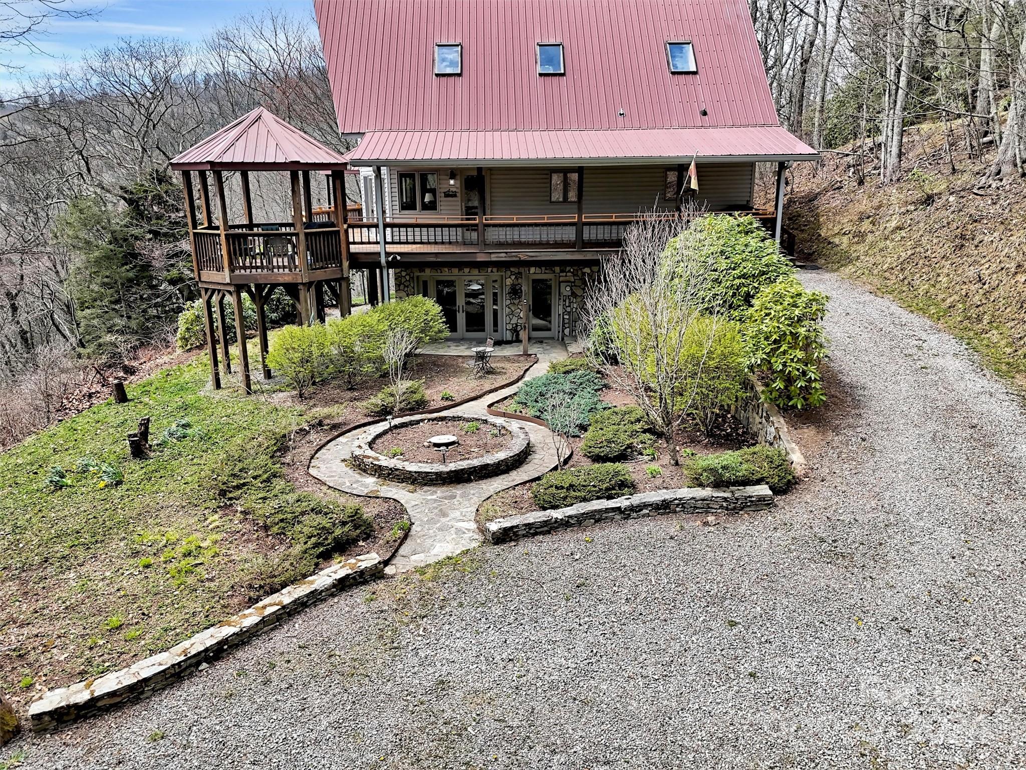 2521 Pless Underwood Road Maggie Valley, NC 28751 - Photo 44 of 46 a view of a house with backyard and sitting area