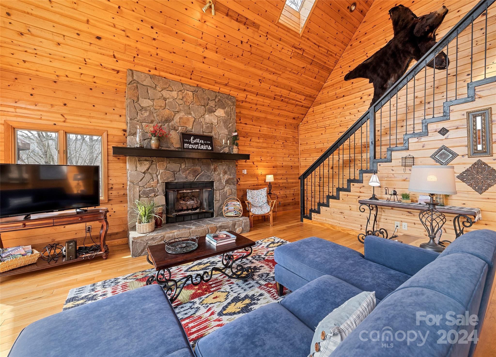 2521 Pless Underwood Road Maggie Valley, NC 28751 - Photo 9 of 46 a living room with furniture and a flat screen tv