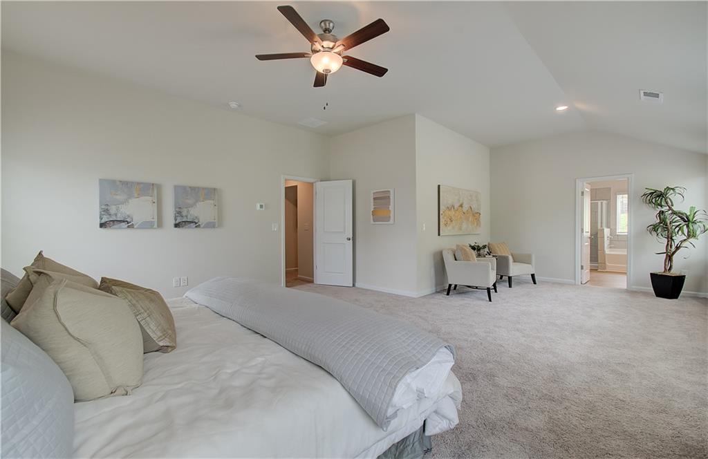 467 Collier Mls Road Lawrenceville, GA 30045 - Photo 32 of 39 a bedroom with a bed and a chair