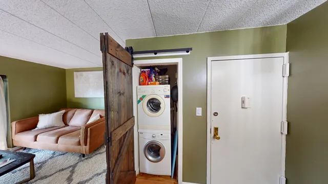 a kitchen with granite countertop a refrigerator and a sink