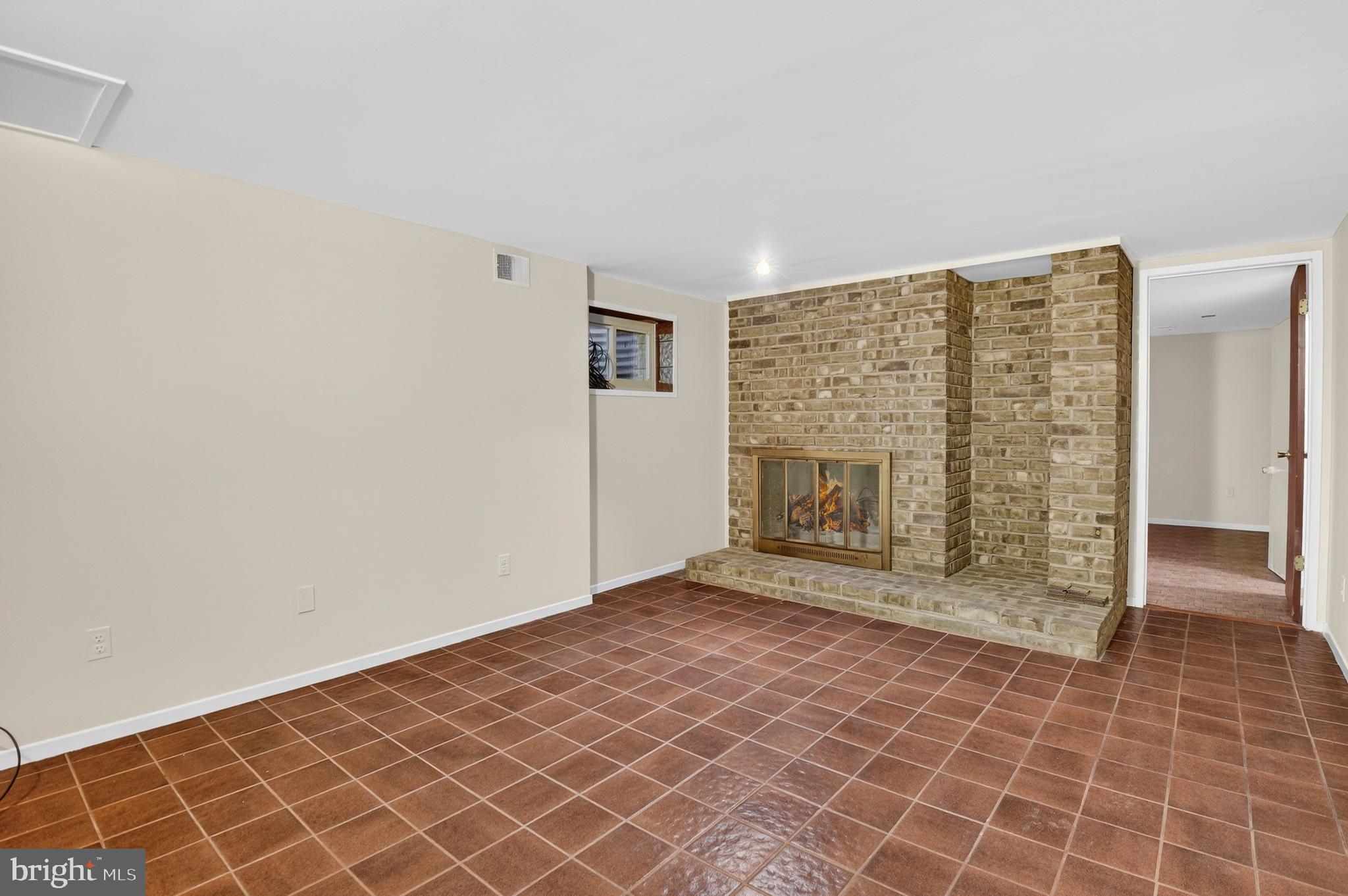19144 Roman Way Gaithersburg, MD 20886 - Photo 26 of 31 a view of an empty room with a fireplace