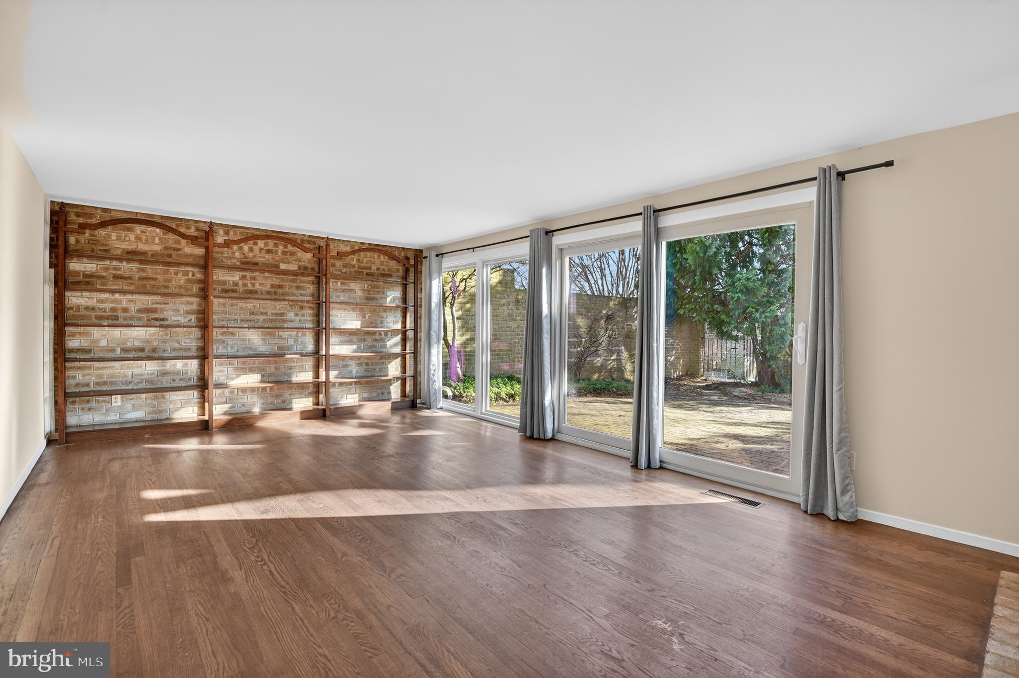 19144 Roman Way Gaithersburg, MD 20886 - Photo 7 of 31 wooden floor in an empty room with a window