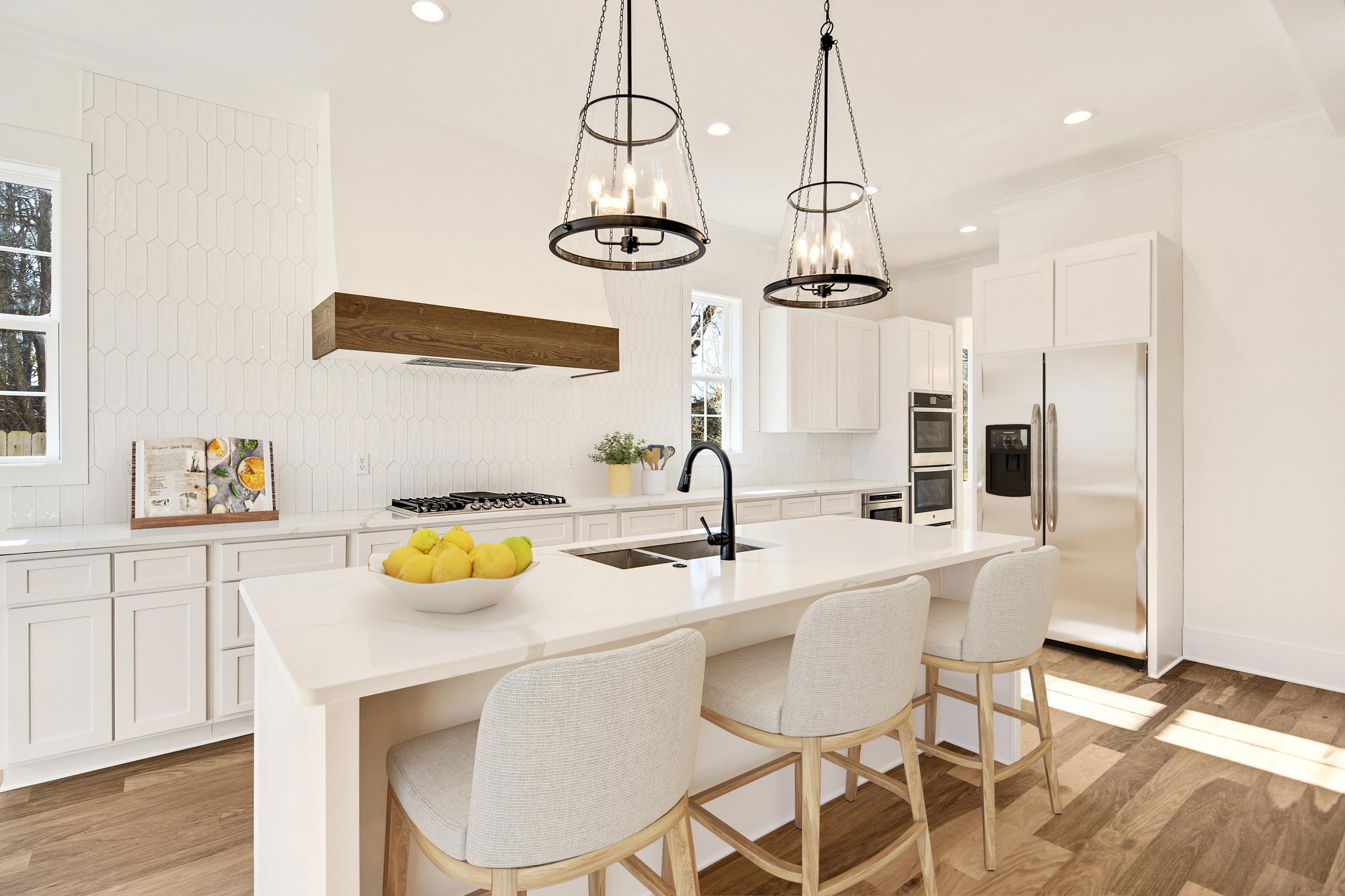 641 Fletcher Road Collierville, TN 38017 - Photo 7 of 39 a kitchen with a table and chairs in it