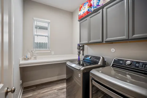 a kitchen that has a sink and a stove