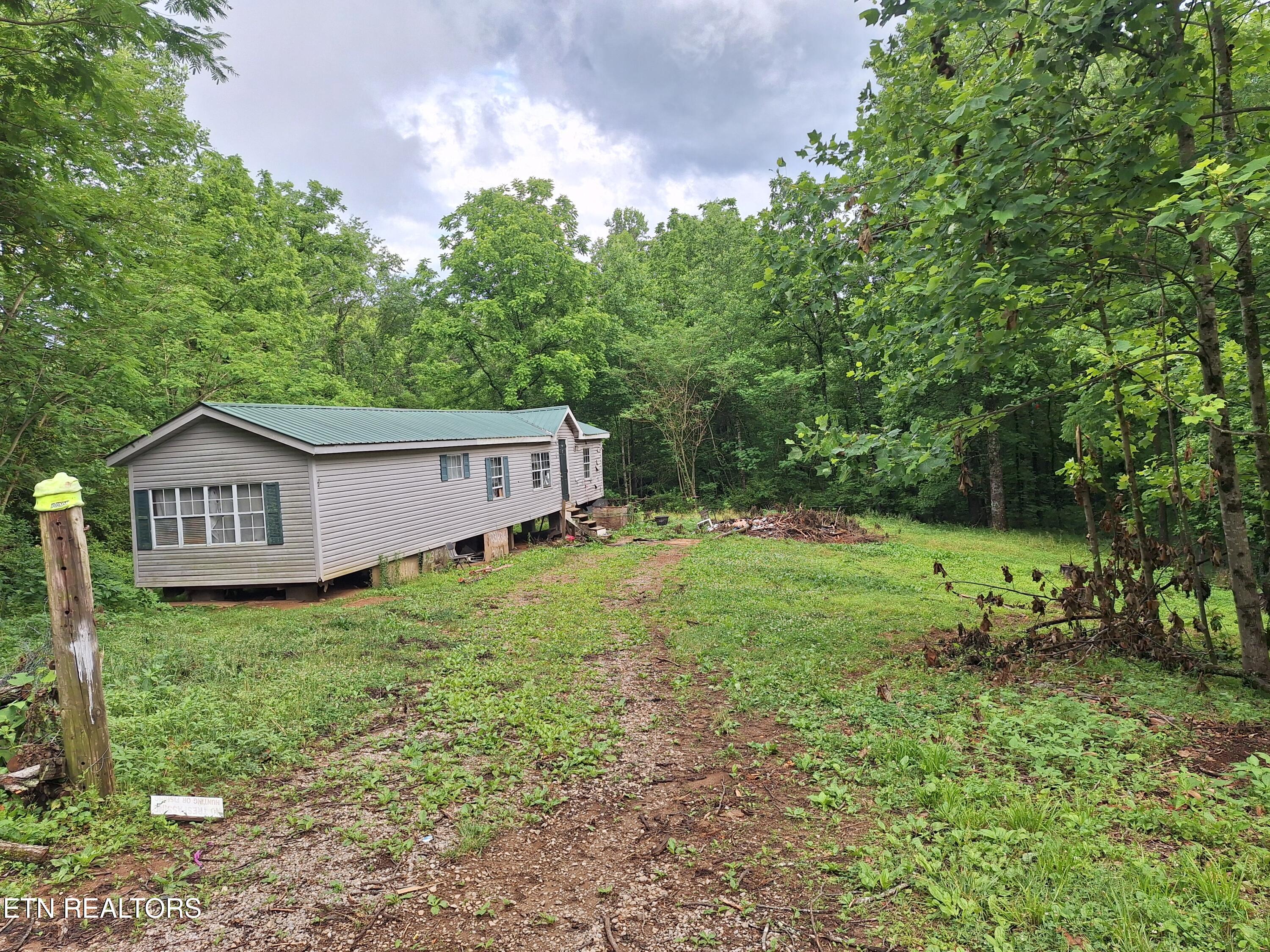 160 Mountain Road Tellico Plains, TN 37385 - Photo 2 of 10 20260521_181224